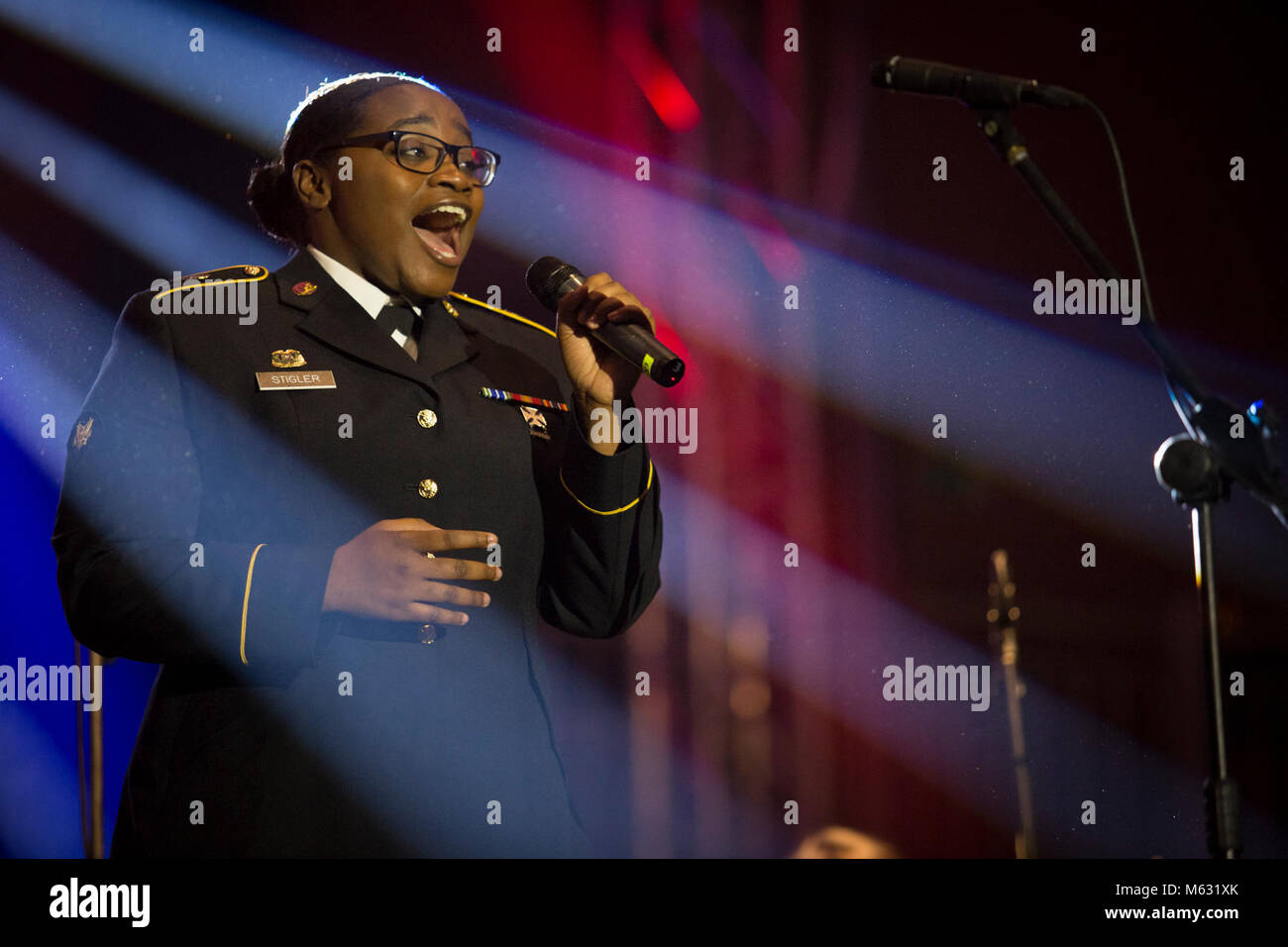 U.S. Army Spc. Erika Stigler, chorus member with the USAREUR Band and Chorus, sings a solo during the Polish American Music Show in Tarnowo Podgorne, Poland.    (U.S. Army Stock Photo