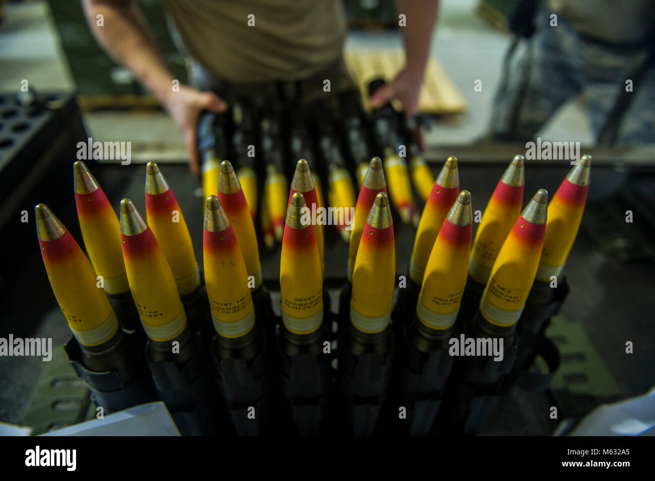 A munitions technician with the 1st Special Operations Maintenance Squadron inspects 30mm rounds at Hurlburt Field, Fla., Feb. 6, 2018. Once crew members are done inspecting the ammunition, they pack them into cartridges to be delivered to aircraft. (U.S. Air Force Stock Photo