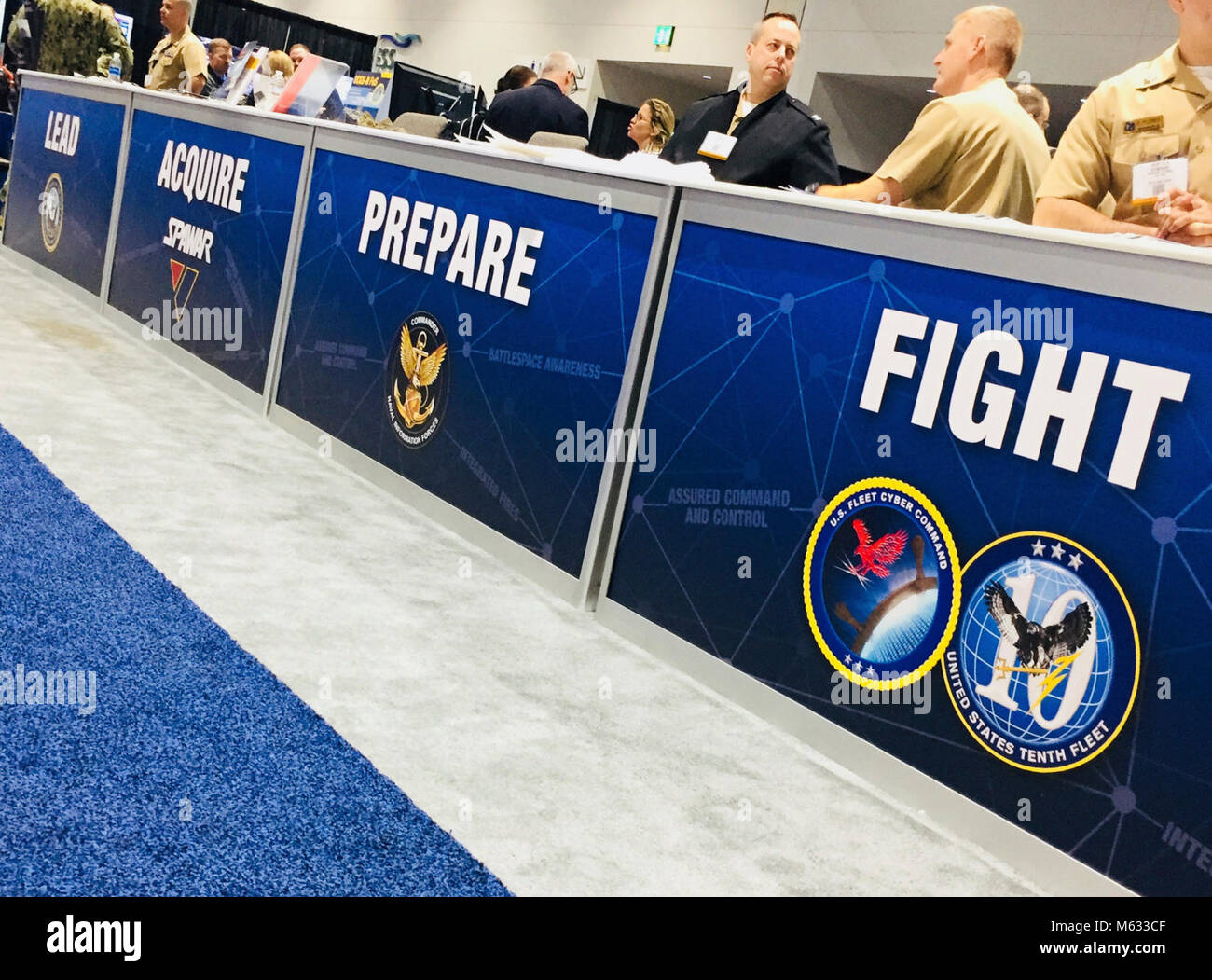 SAN DIEGO (Feb. 8, 2018) – U.S. Navy Information Warfare command representatives man the IW pavilion at WEST 2018 at the San Diego Convention Center on. Feb. 8. The IW pavilion on the exhibition floor demonstrates the Navy's commitment to warfighting in the information age through the use of speakers, panels, subject matter experts and capability displays. The Deputy Chief of Naval Operations for Information Warfare (OPNAV N2N6) “leads” the IW community from Washington, D.C. and provides strategic guidance on information warfare. Space and Naval Warfare Systems Command (SPAWAR) “acquires” the  Stock Photo