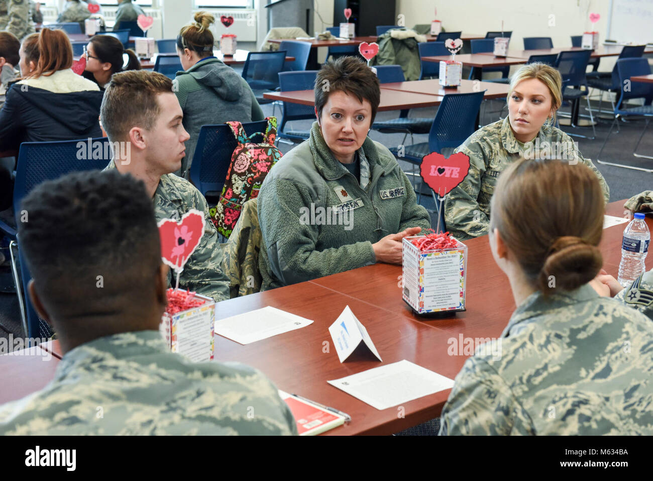 Maj. Melanie Grosjean, commander of the Logistics Readiness Squadron at the 180th Fighter Wing in Swanton, Ohio, speaks to junior Airman at the speed mentorship event on February 10, 2018. Speed mentorship allows participants to network with mentors in various career fields and varying stages of military career development. Stock Photo