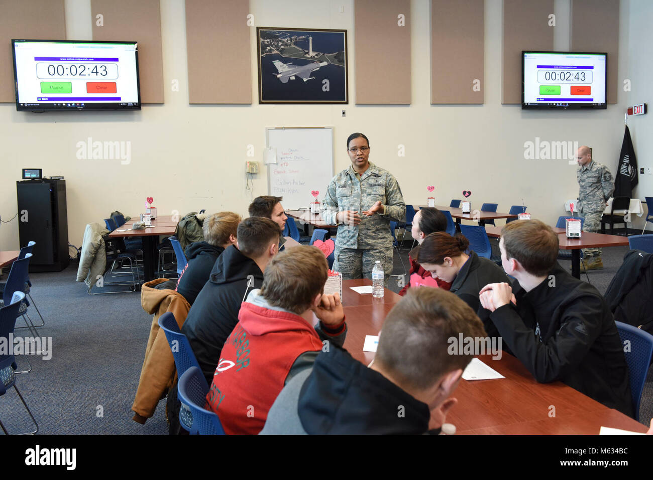 Chief Master Sgt. Constance McGuire, superintendent of the Medical Group at the 180th Fighter Wing in Swanton, Ohio, speaks to junior Airman at the speed mentorship event on February 10, 2018. Speed mentorship allows participants to network with mentors in various career fields and varying stages of military career development. Stock Photo