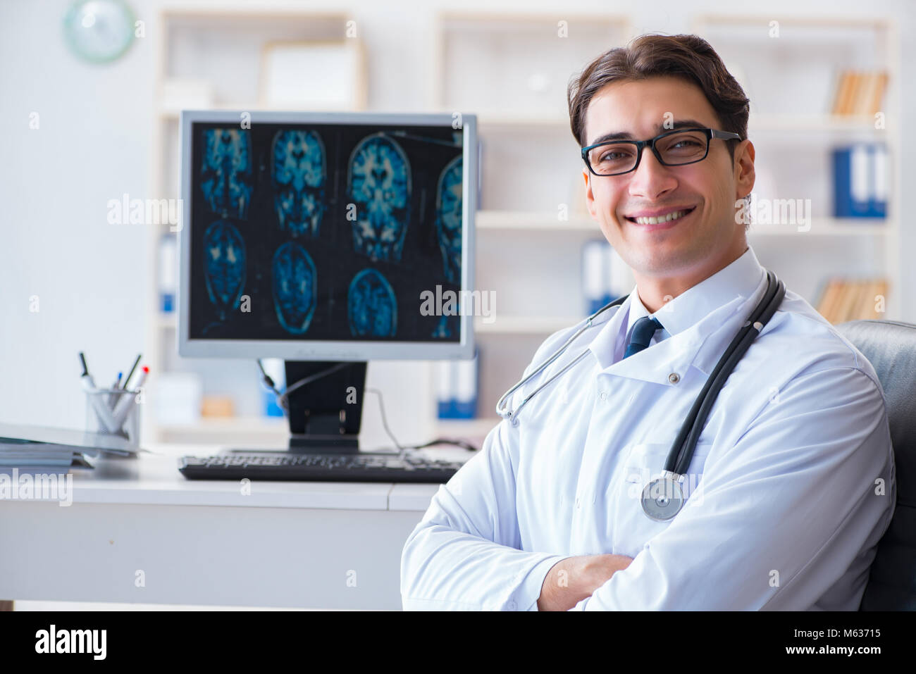 Doctor radiologist looking at x-ray images Stock Photo - Alamy