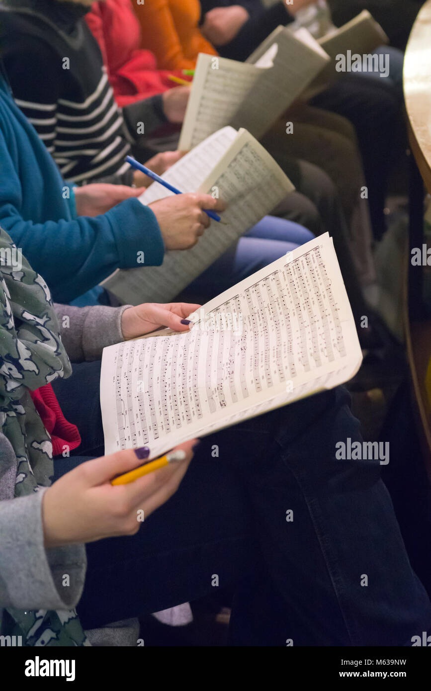 Choir singers holding musical score Stock Photo Alamy
