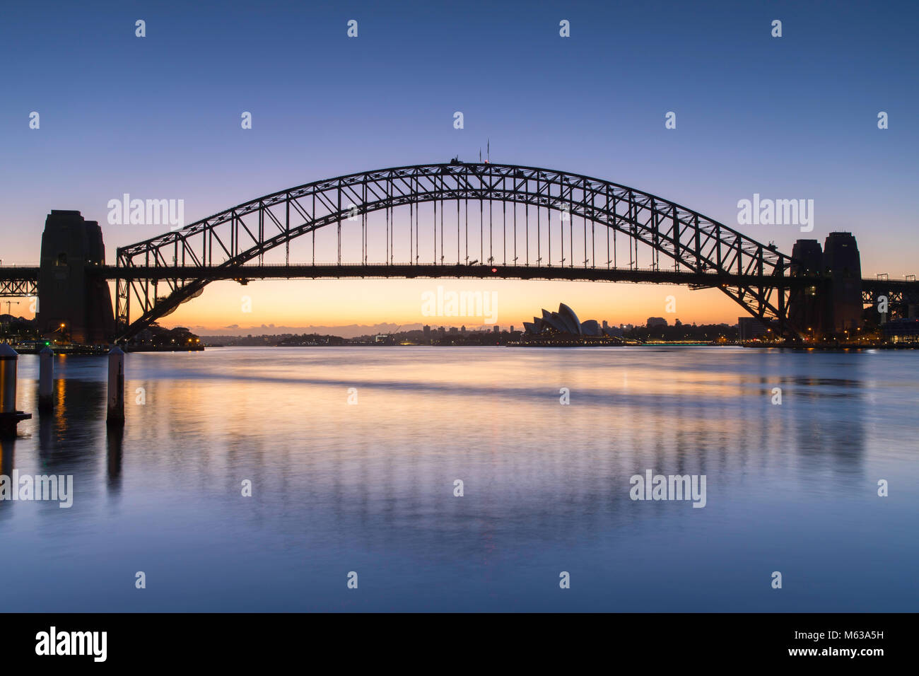 Sydney Harbour Bridge and Sydney Opera House at dawn, Sydney, New South Wales, Australia Stock Photo