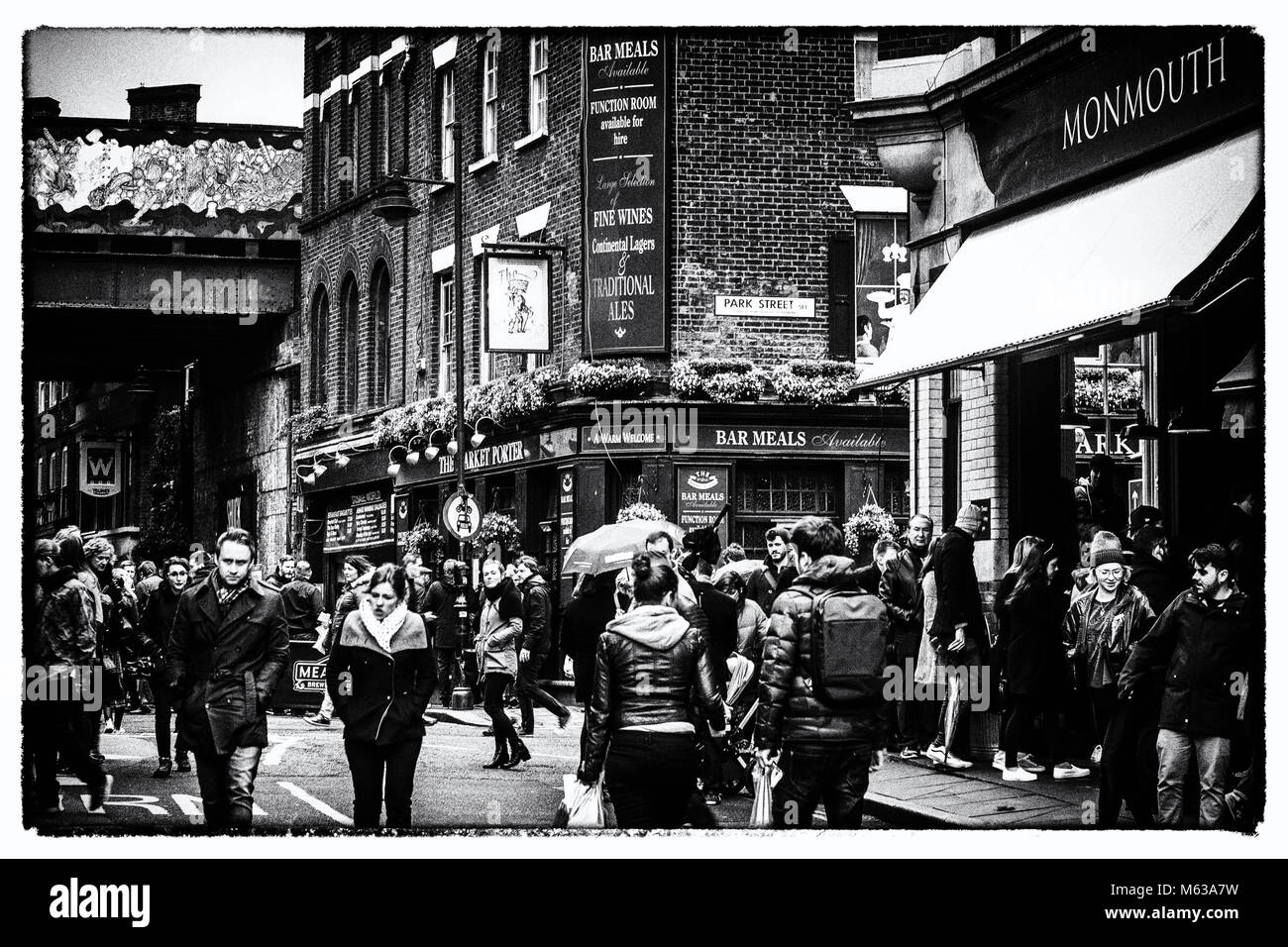 A busy street scene at London's Borough Market, in Black & White Stock Photo
