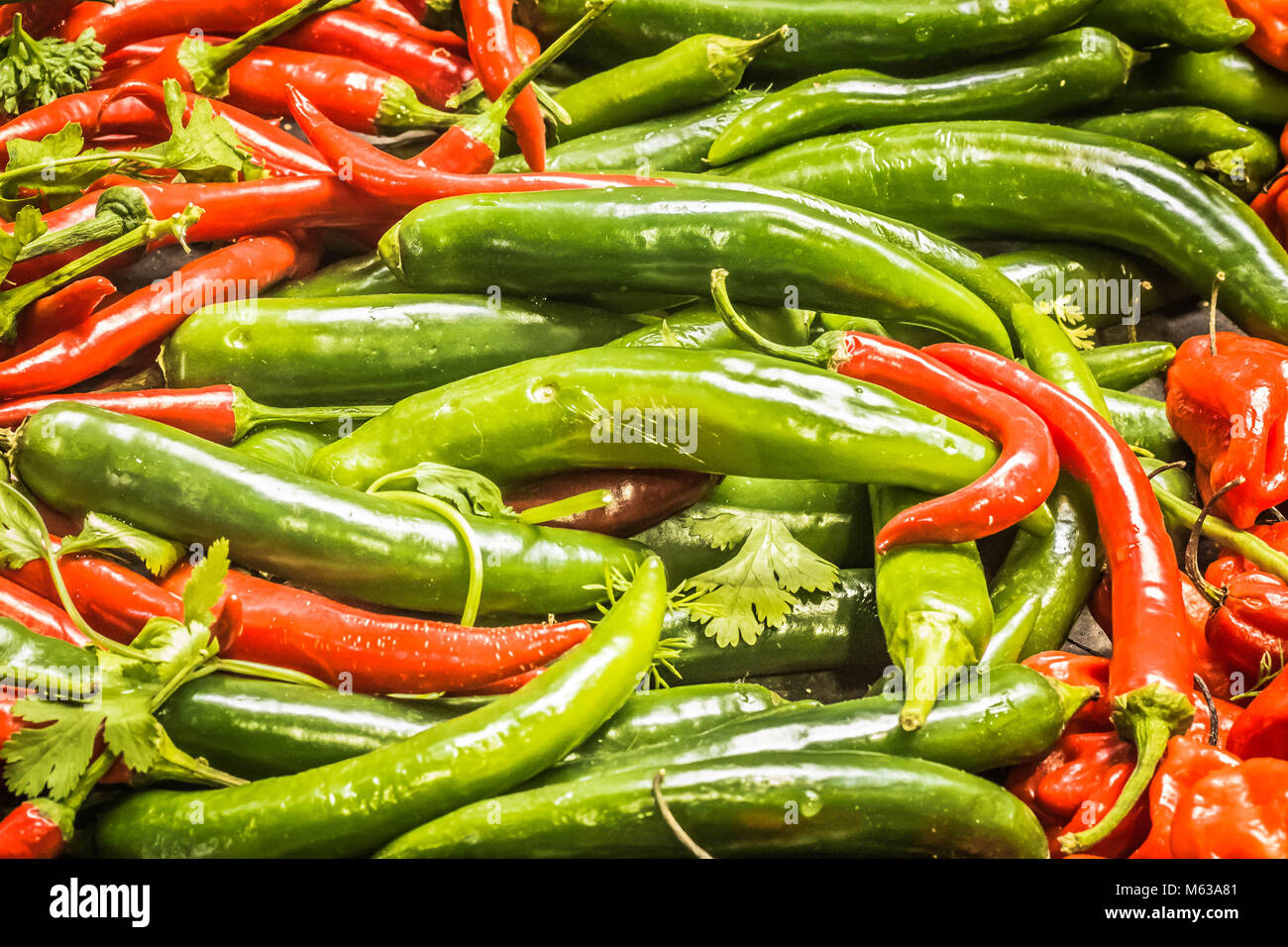 Mixed red and green chilli peppers at Borough market, London UK Stock Photo