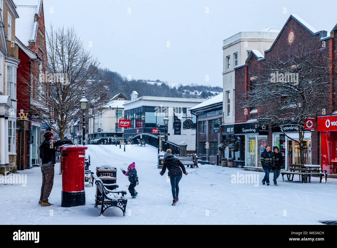 Local people playing in the snow, Lewes, Sussex, UK Stock Photo