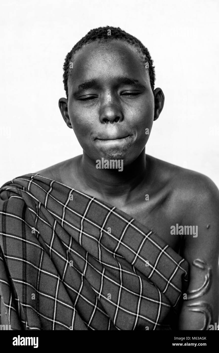 A Portrait Of A Young Woman From The Bodi Tribe, Bodi Village, Omo ...