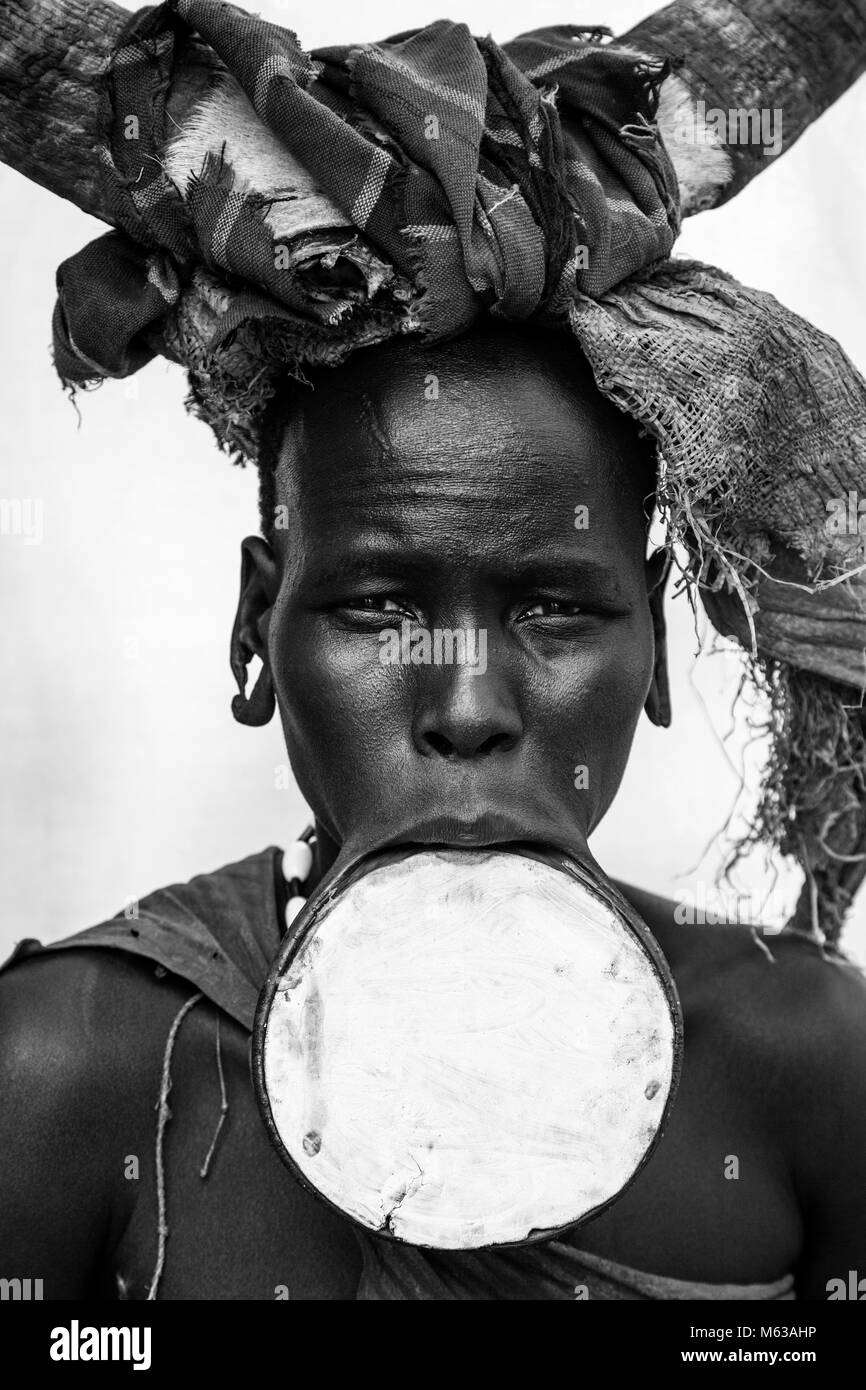 A Portrait Of A Young Woman From The Mursi Tribe, Mursi Village, Omo ...