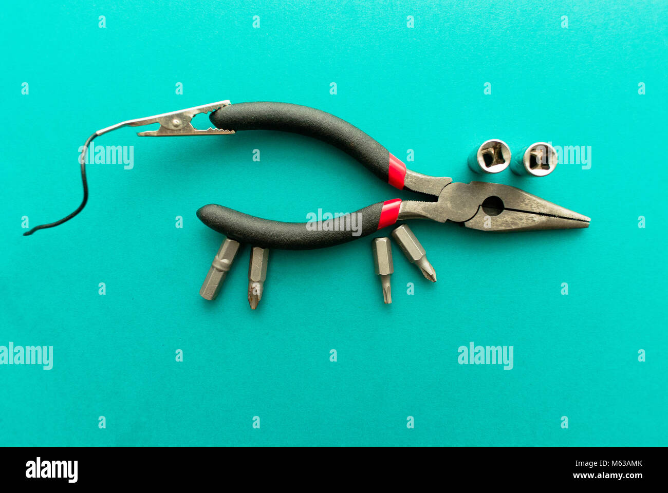 Set of tools on green background. It looks like a mouse. Working ...