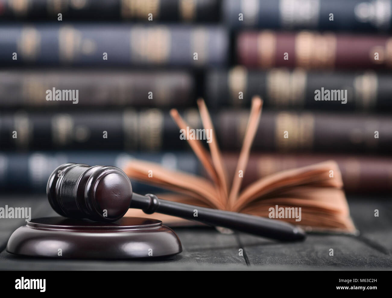 Law and Justice , Legality concept, Judge Gavel and law book on a black wooden background, law library concept. Stock Photo