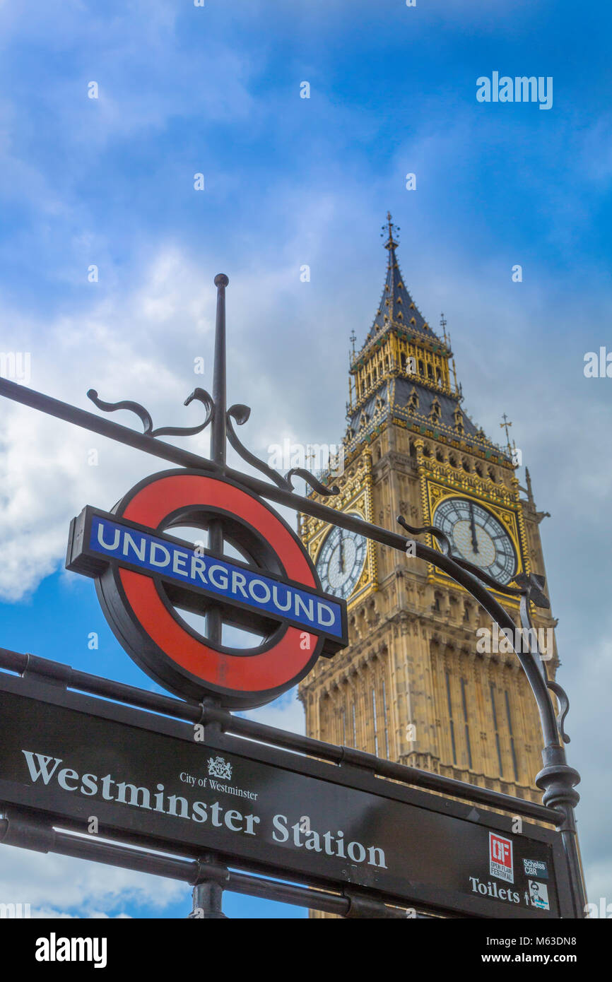 Westminister Underground station sign in front of the Elizabeth Tower at 12 noon. Stock Photo