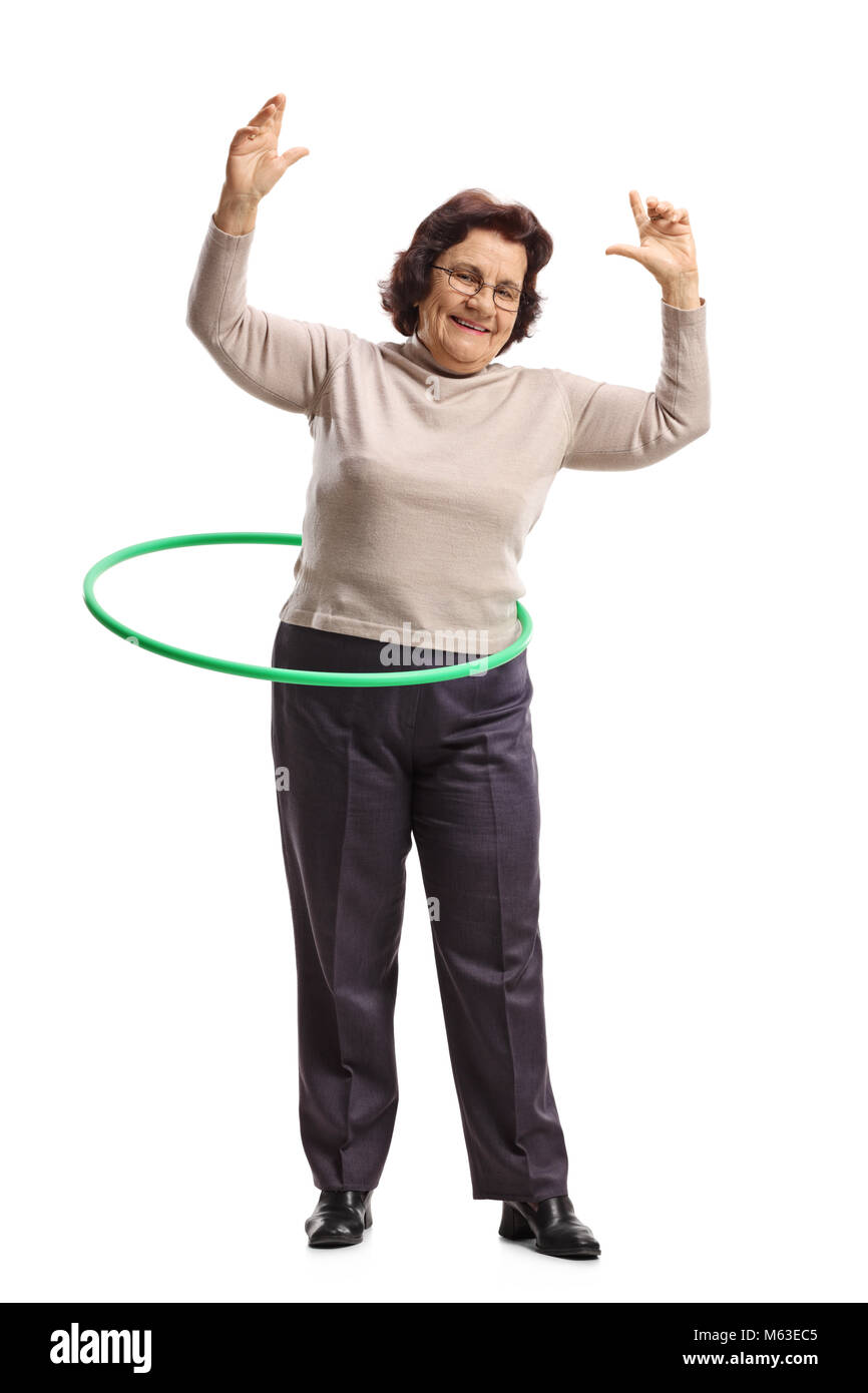 Full length portrait of an elderly woman with a hula-hoop isolated on white background Stock Photo