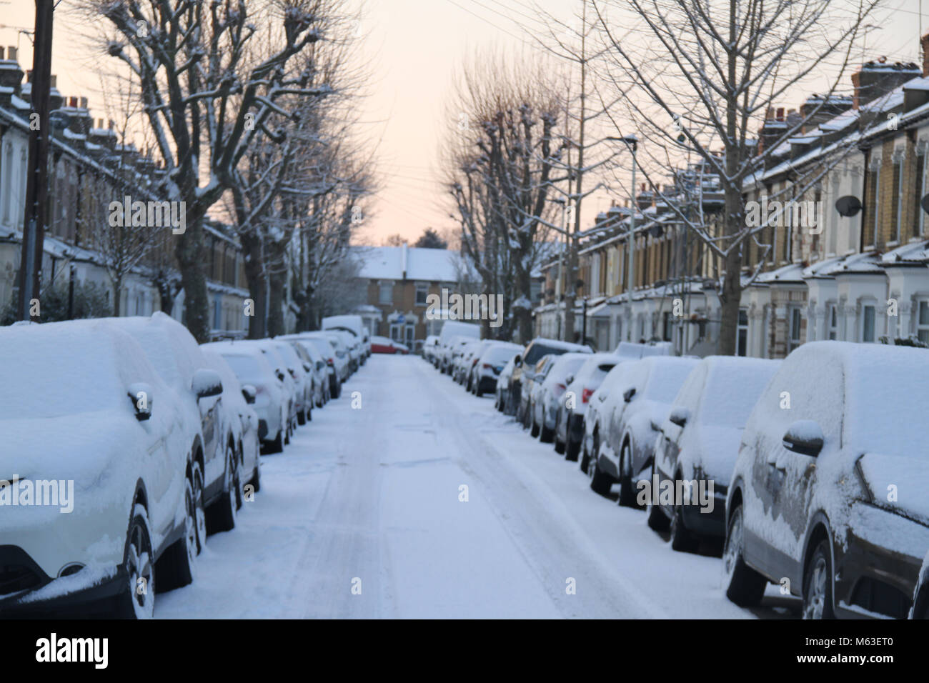 LONDON, UK - February 28: Streets of East London were covered with snow following a shower on 28 February. The Met Department issued an amber warning causing airport closure and rail cancellation Credit: David Mbiyu/Alamy Live News Stock Photo