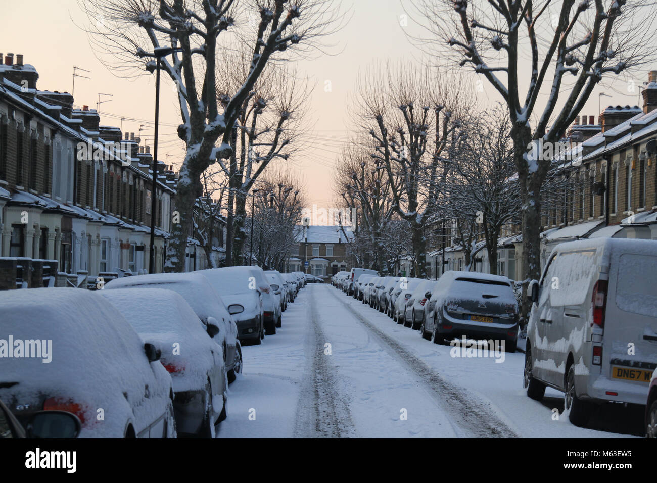 LONDON, UK - February 28: Streets of East London were covered with snow following a shower on 28 February. The Met Department issued an amber warning causing airport closure and rail cancellation Credit: David Mbiyu/Alamy Live News Stock Photo
