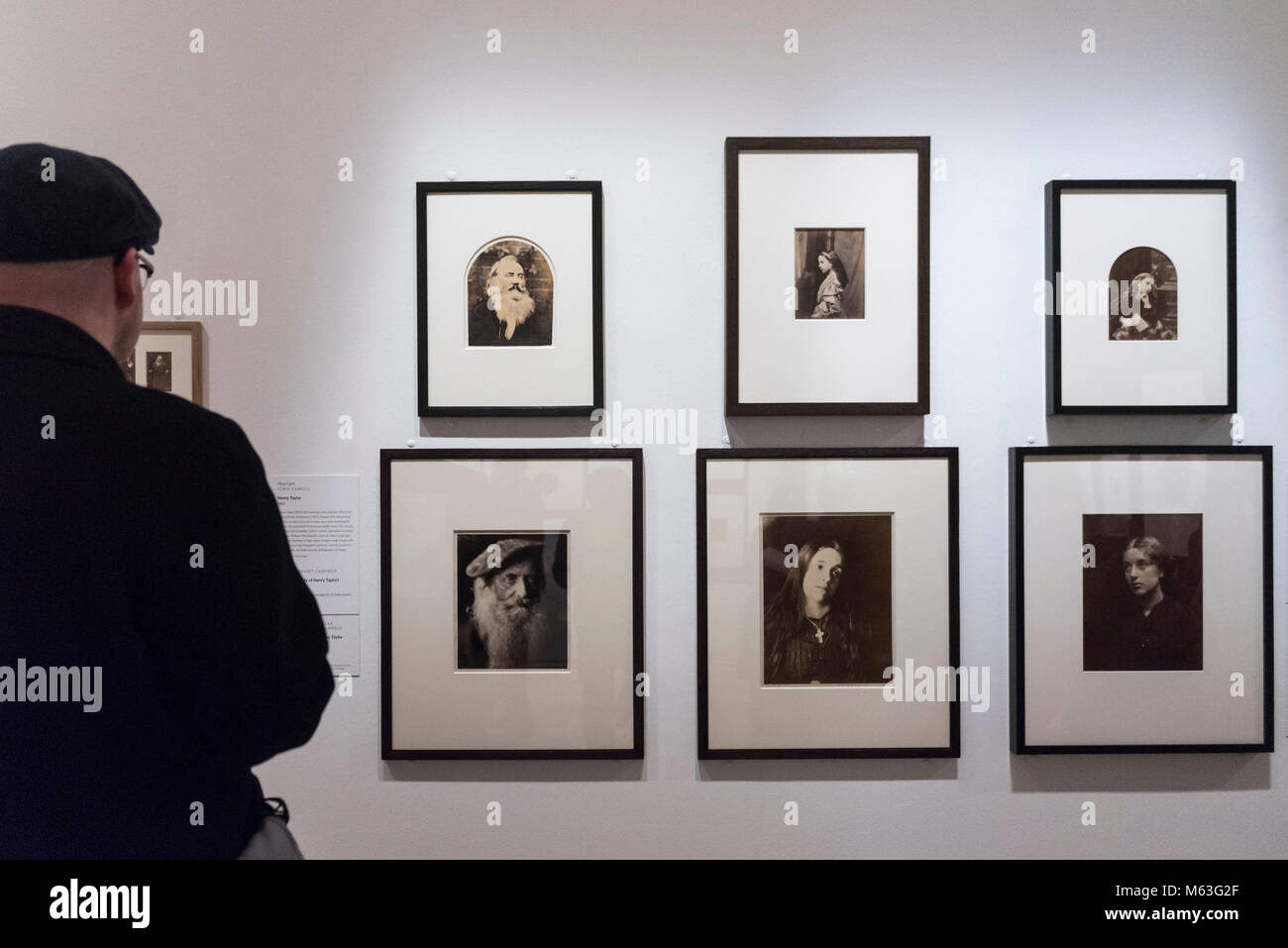 London, UK.  28 February 2018. A visitor views images at the preview of "Victorian Giants:  The Birth of Art Photography" at the National Portrait Gallery featuring works by Lewis Carroll, Julia Margaret Cameron, Oscar Rejlander and Clementina Hawarden. Credit: Stephen Chung/Alamy Live News Stock Photo