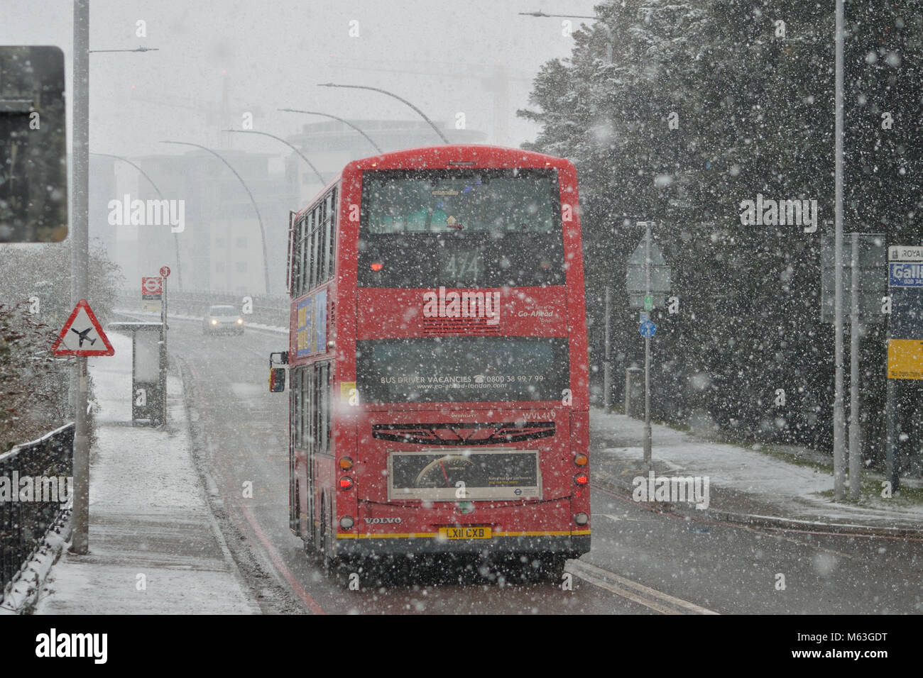 London, UK, 28th February 2018 Heavy snow in East London as a result of the #BeastfromtheEast winter storm – TfL Bus operating in blizzard conditions operating route 474. Credit: A Christy/Alamy Live News. Stock Photo