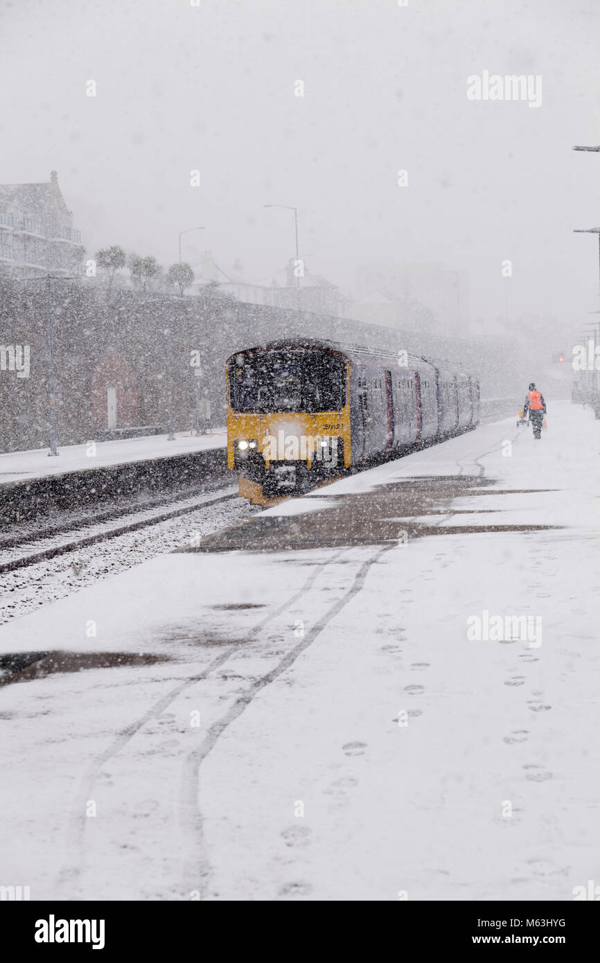 Penzance, Cornwall, UK. 28th Feb, 2018. Heavy snowfall in Penzance, Cornwall. Commuter Train arrives at Penzance during heavy snow blizzard Credit: Bob Sharples/Alamy Live News Stock Photo