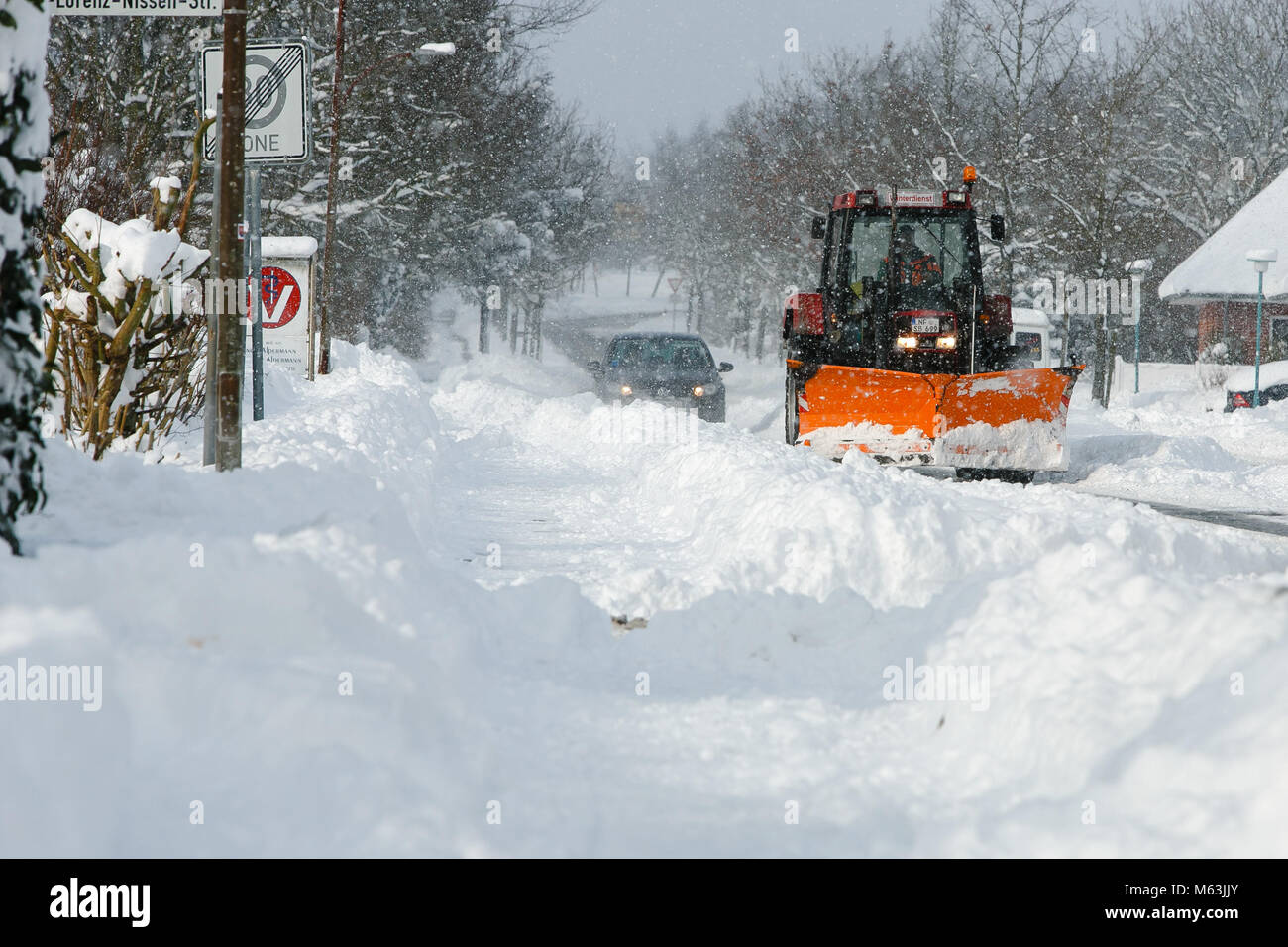 Bredstedt, Germany. 28th Feb, 2018. A snow plough in operation in Bredstedt, Germany, 28 February 2018. Strong snowfall lead to a difficult traffic situation on the streets of Nordfriesland. Credit: Frank Molter/dpa/Alamy Live News Stock Photo