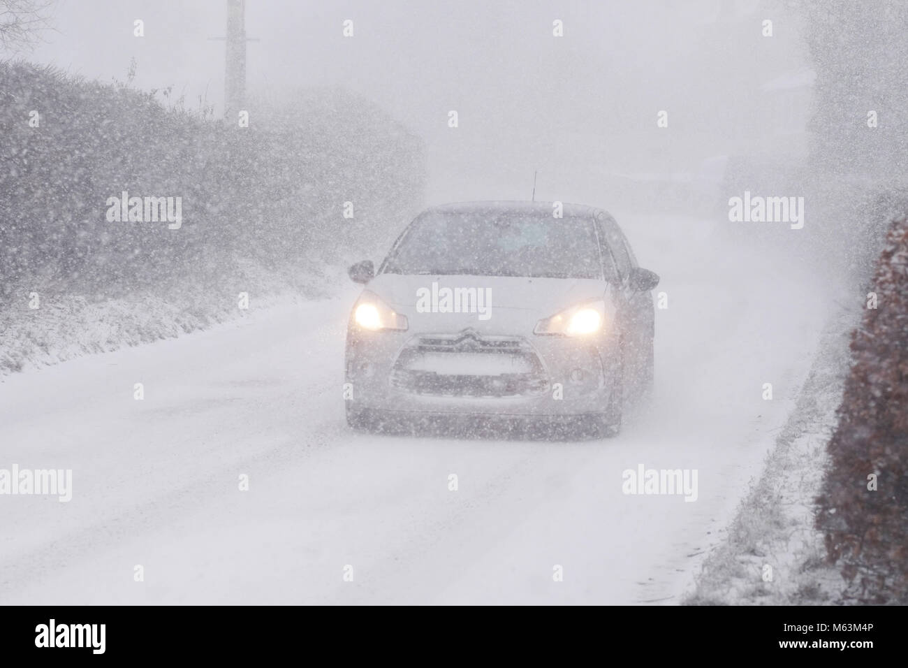 Titley, Herefordshire, UK - Wednesday 28th February 2018 - Heavy snow showers blowing in from the East at 4pm making driving conditions hazardous for car drivers in rural Herefordshire. Photo Steven May / Alamy Live News Stock Photo