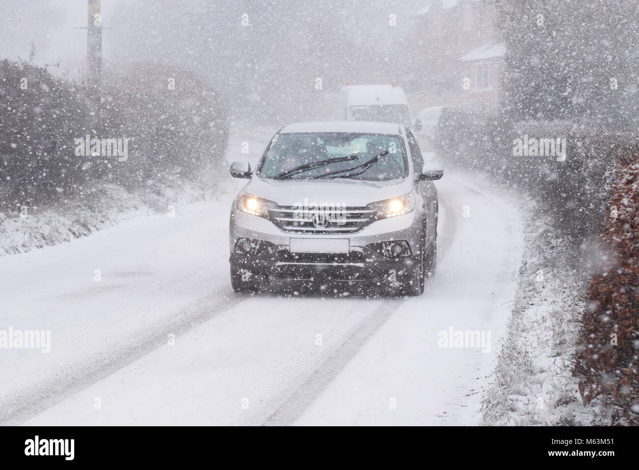 Titley, Herefordshire, UK - Wednesday 28th February 2018 - Heavy snow showers blowing in from the East at 4pm making driving conditions hazardous for car drivers in rural Herefordshire. Photo Steven May / Alamy Live News Stock Photo