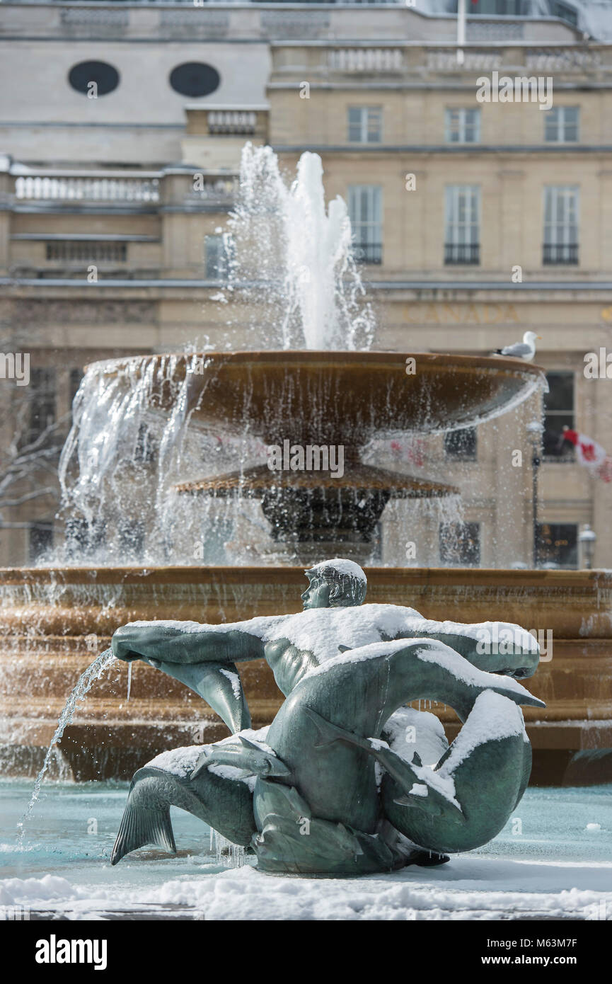London, UK. 28th February, 2018. The frozen fountains of trafalgar square provide amunition and entertainment for tourists. Credit: Guy Bell/Alamy Live News Stock Photo