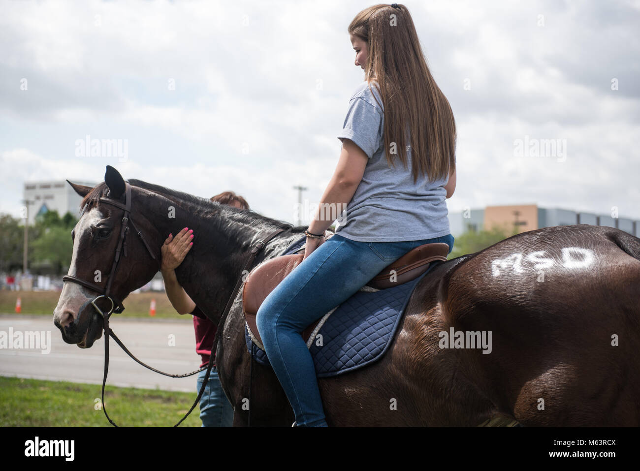 Parkland, Florida, USA. 28th Feb, 2018. Kristal Coleman, 15, a student at Marjory Stoneman Douglas High School, rides her horse home at the end of the first day of classes since the February 14 massacre. Credit: Orit Ben-Ezzer/ZUMA Wire/Alamy Live News Stock Photo