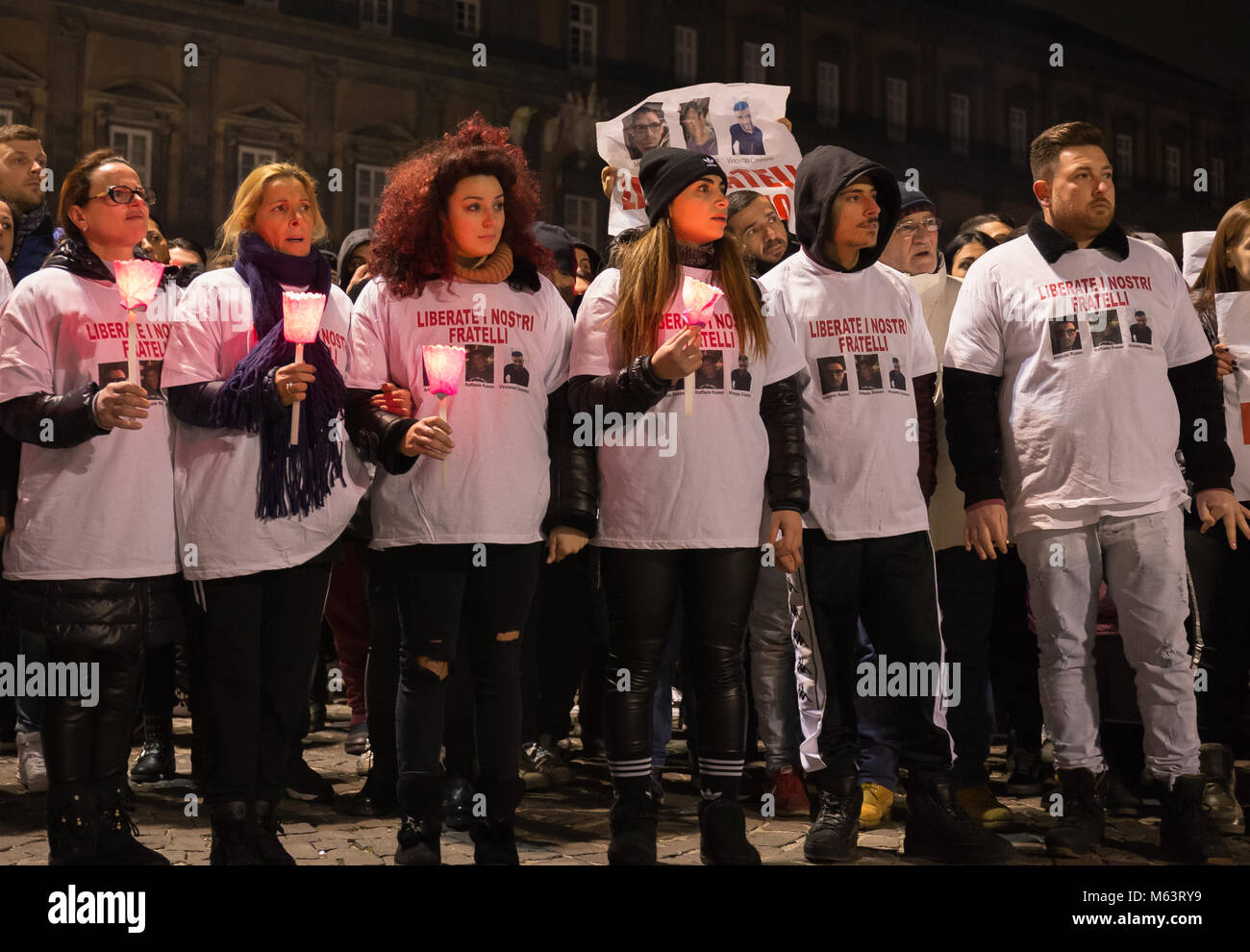 Naples, Campania, Italy. 28th Feb, 2018. Demonstrator seen holding candles during the rally.Rally organized by the family of the three Neapolitan men kidnapped in TecalitlÃ n in Mexico, they demand their immediate release. Credit: EVicinanza Desaparecidos 3 .jpg/SOPA Images/ZUMA Wire/Alamy Live News Stock Photo