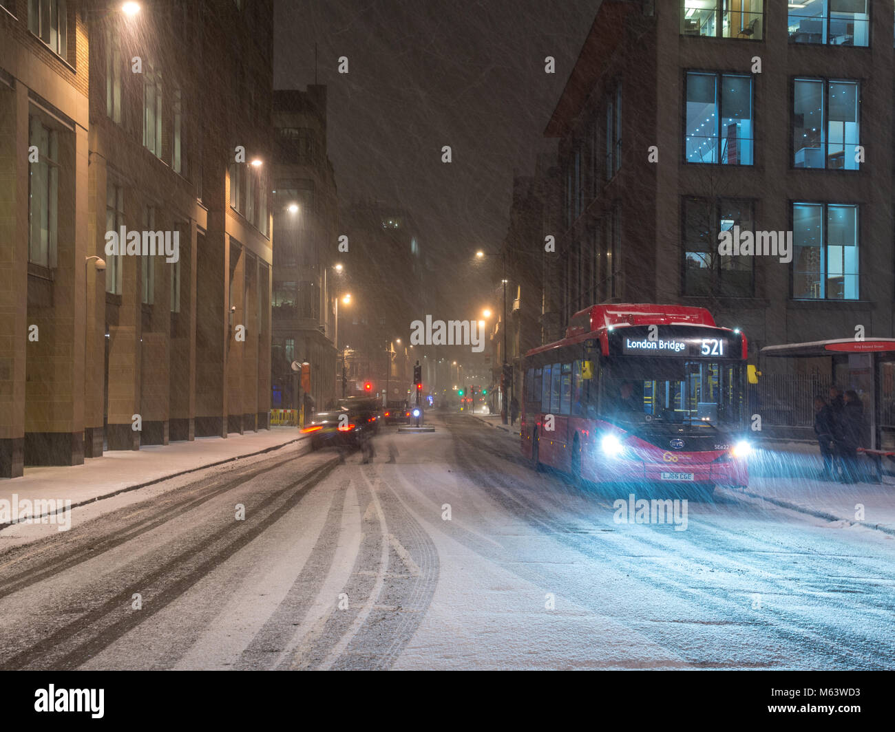 London, England, UK. 28th Feb, 2018. UK Weather: Traffic creates trains in snow falling on Newgate Street during the 'Beast From The East' snowstorm in the City of London. Credit: Joe Dunckley/Alamy Live News Stock Photo