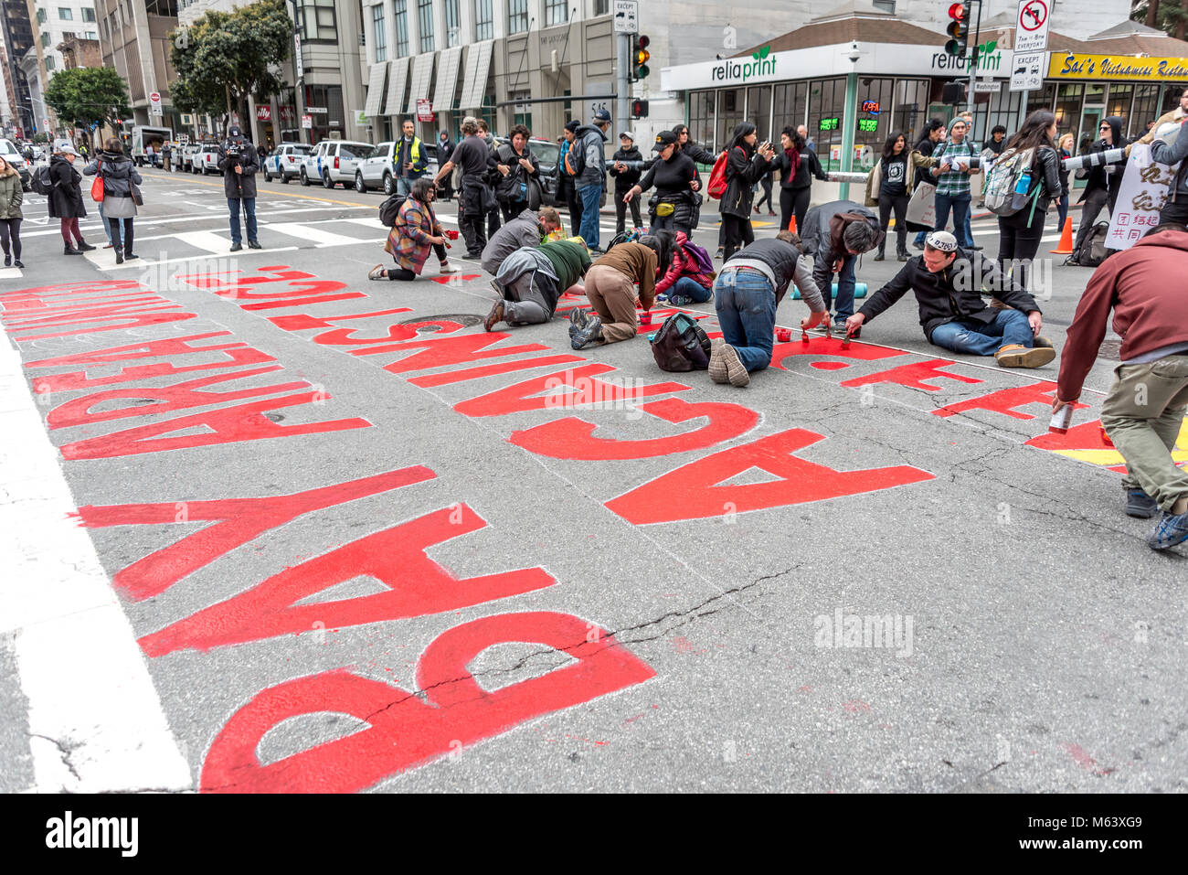 San Francisco, USA. 28th February, 2018. An estimated three hundred protesters gather outside San Francisco Immigration and Customs Enforcement building (ICE) to protest recent arrests of at least 150 people in ICE operations conducted over the previous few days in Northern California. San Francisco remains a sanctuary city. Shelly Rivoli/Alamy Live News Stock Photo