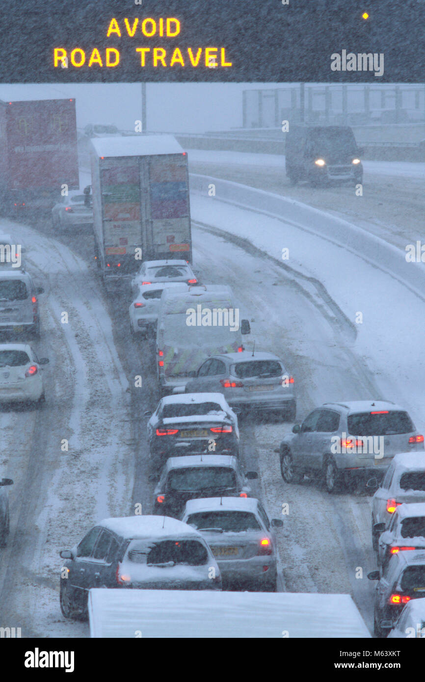 Glasgow, UK. 28th Feb, 2018. Blizzard conditions cause hazardous driving conditions on the M74, bringing traffic to a near standstill. A red weather warning is in place across central Scotland until 10.00am. Credit: Alan Paterson/Alamy Live News Stock Photo