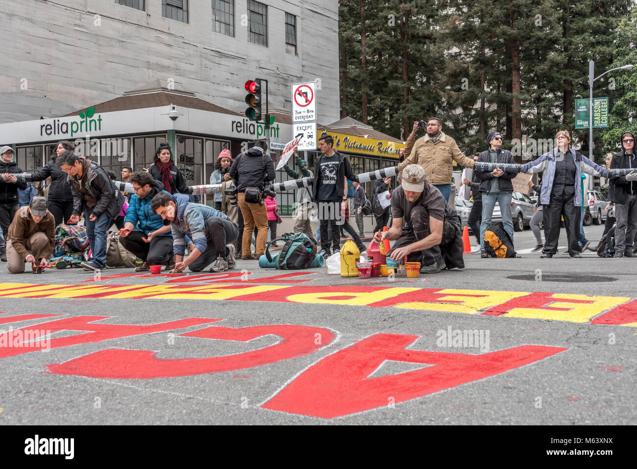 San Francisco, USA. 28th February, 2018. An estimated three hundred protesters gather outside San Francisco Immigration and Customs Enforcement building (ICE) to protest recent arrests of at least 150 people in ICE operations conducted over the previous few days in Northern California. San Francisco remains a sanctuary city. Shelly Rivoli/Alamy Live News Stock Photo