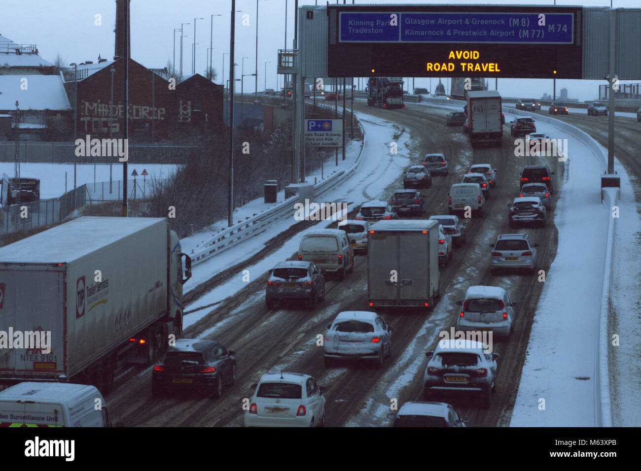 Glasgow, UK. 28th Feb, 2018. Blizzard conditions cause hazardous driving conditions on the M74, bringing traffic to a near standstill. A red weather warning is in place across central Scotland until 10.00am. Credit: Alan Paterson/Alamy Live News Stock Photo
