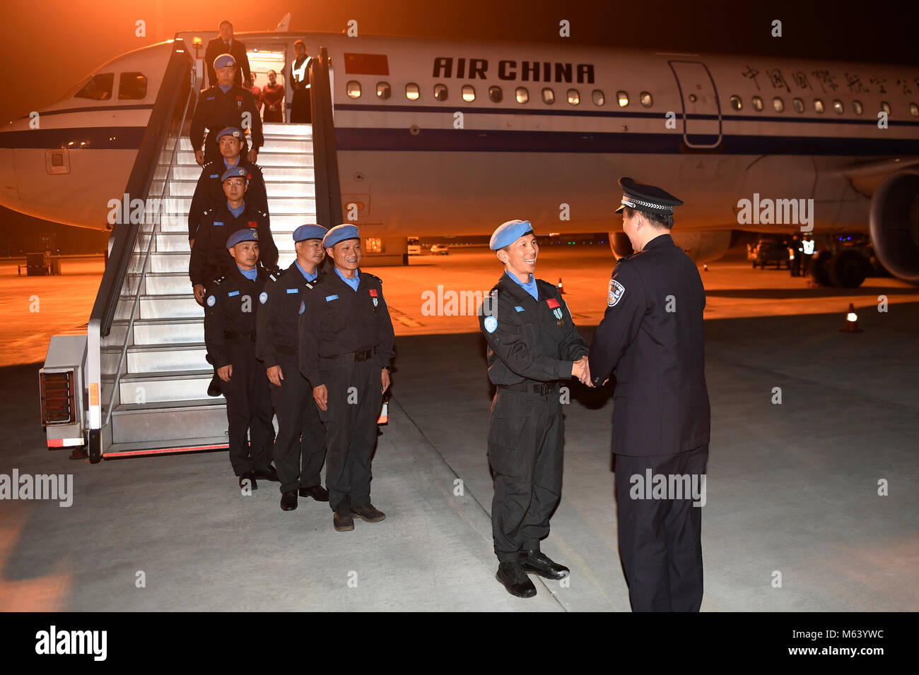 (180228) -- HANGZHOU, Feb. 28, 2018 (Xinhua) -- Seven Chinese peacekeepers arrive at the Hangzhou Xiaoshan International Airport in Hangzhou, capital of east China's Zhejiang Province, Feb. 27, 2018, after conducting a one-year mission in South Sudan. The sixth team of Chinese peacekeeping police to South Sudan, with the seven members all selected from Zhejiang, arrived in Hangzhou Tuesday evening. In South Sudan, the police officers fulfilled a variety of tasks in the capital Juba and Wau, including patrols of refugee camps, humanitarian aid and community-based police services. (Xinhua/Huang Stock Photo