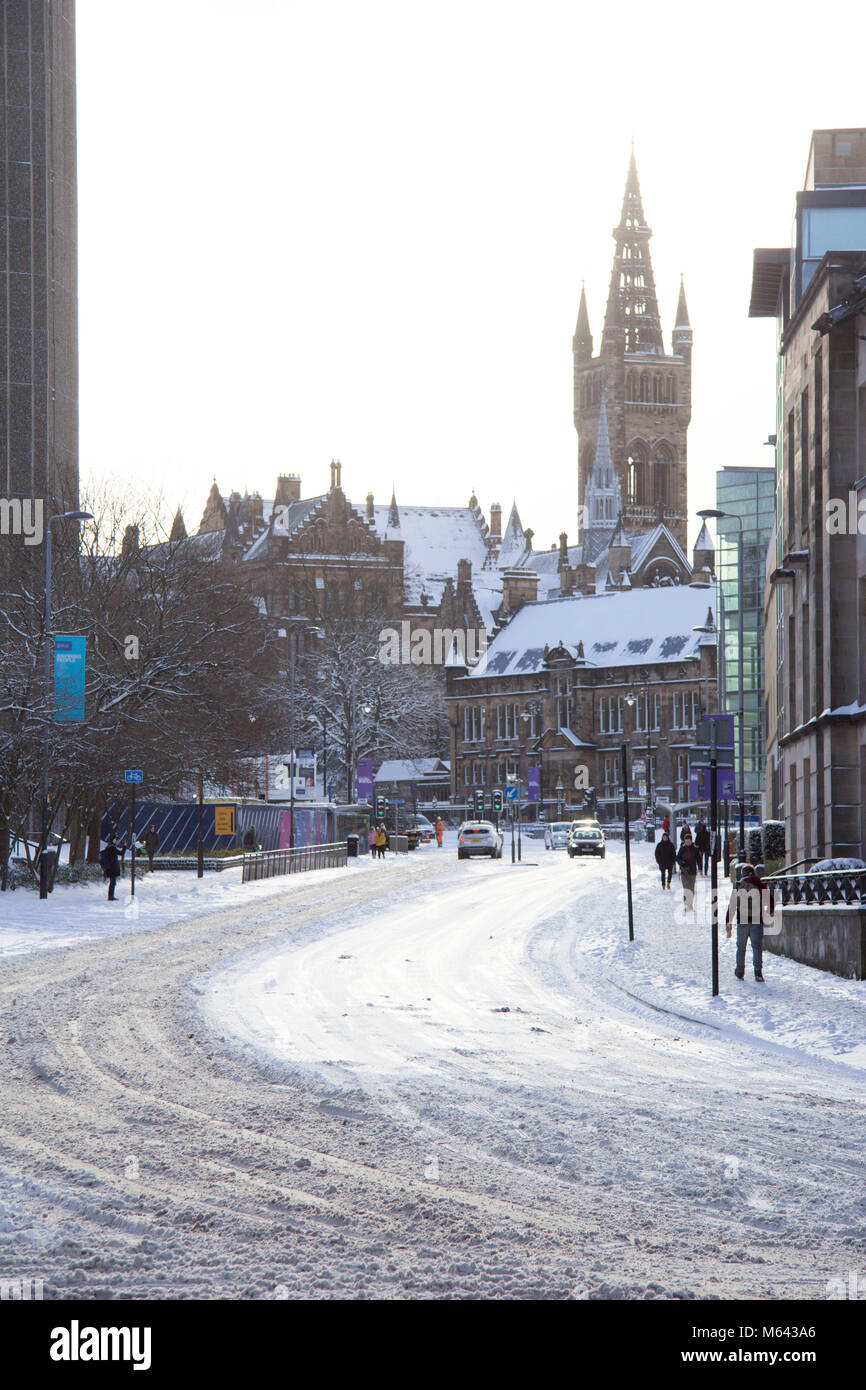 Glasgow, UK. 28th Feb, 2018. UK Weather: A snowy scene of University Avenue and Glasgow University during a lull in the heavy snow storm created by the Beast from the East. Credit: John Bennie/Alamy Live News Stock Photo