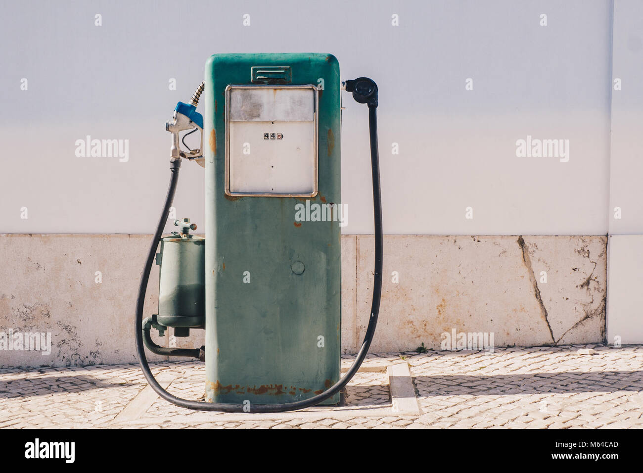 Vintage old gasoline pump and oil dispenser Stock Photo Alamy