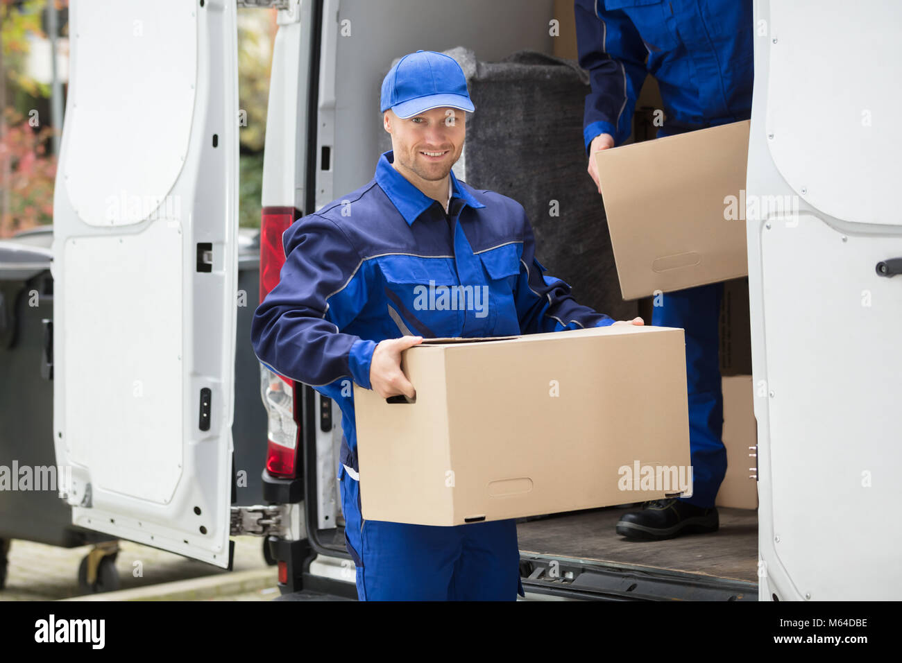 Delivery man front door hi-res stock photography and images - Alamy