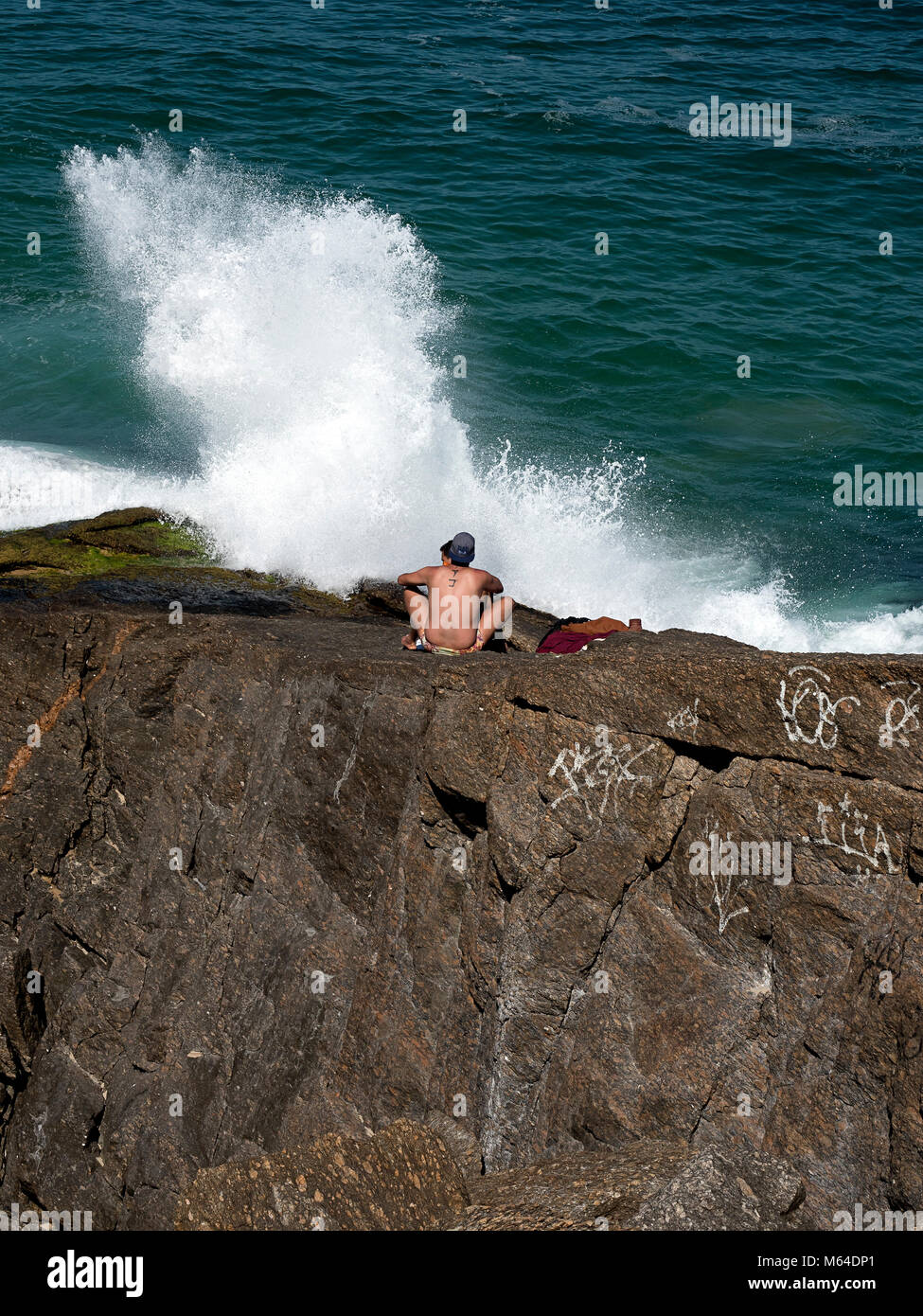 Bathing With Rocks Sun bathing on the rocks, Rio De Janeiro Stock Photo - Alamy