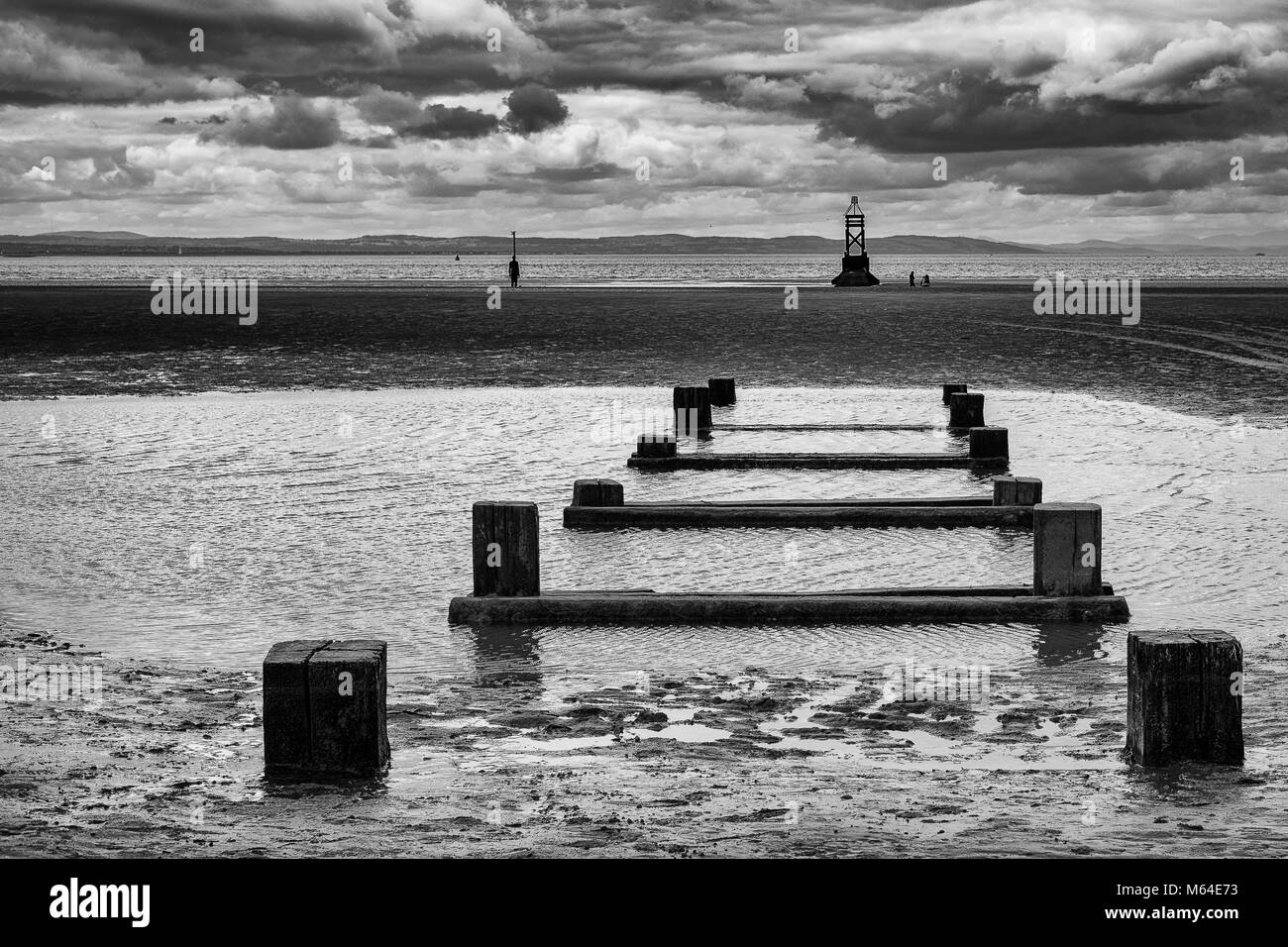 Groynes on Crosby Beach, Merseyside. Shot in Black & White Stock Photo