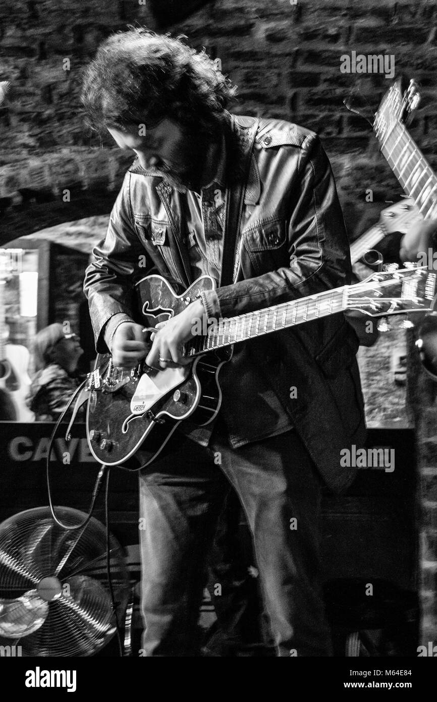 Guitarists performing inside the Cavern Club, Liverpool UK Stock Photo