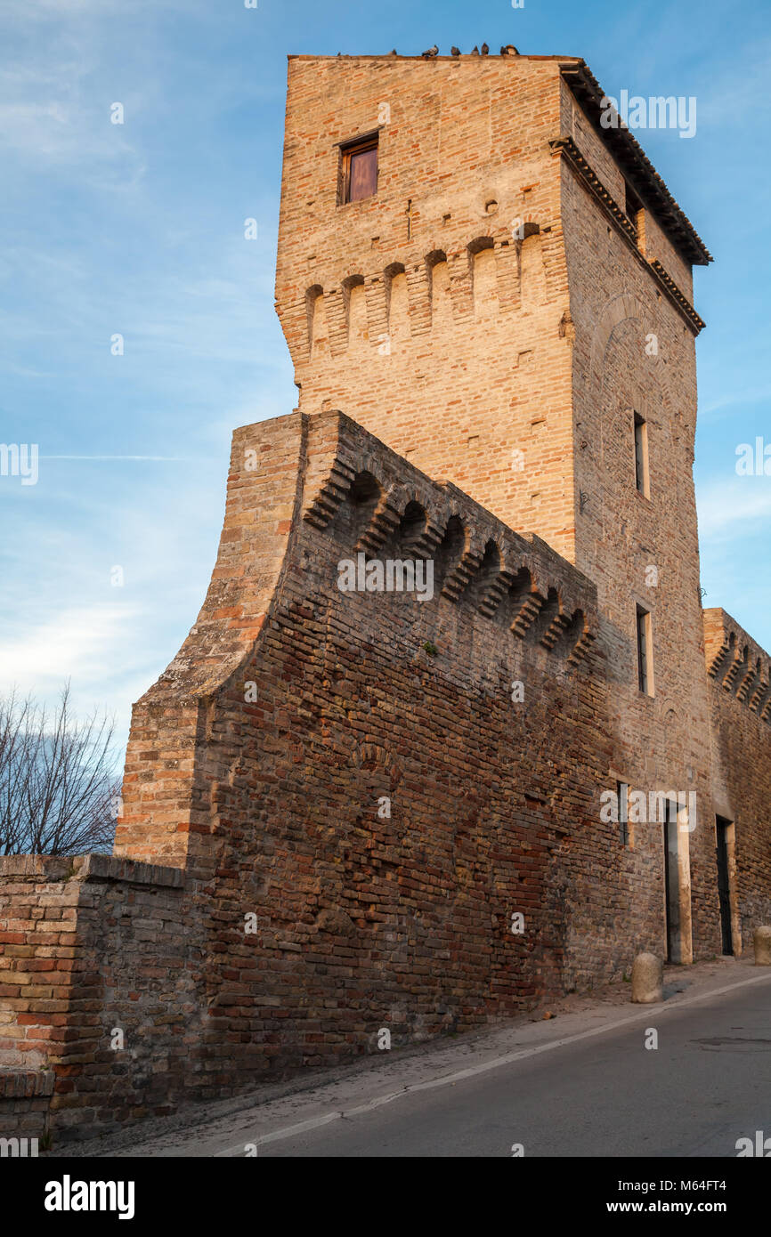 Street view with old fortress wall and tower of Fermo, Italy Stock Photo