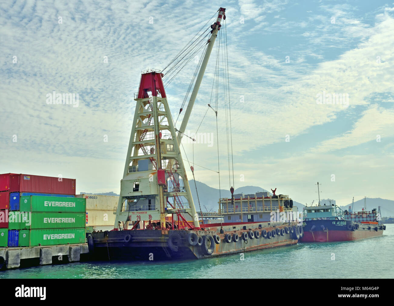 Crane barge for cargo transport in Hong Kong Stock Photo