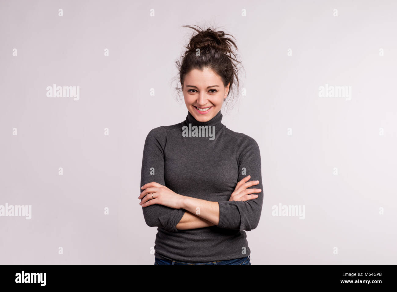 Portrait of a young beautiful woman in studio. Stock Photo