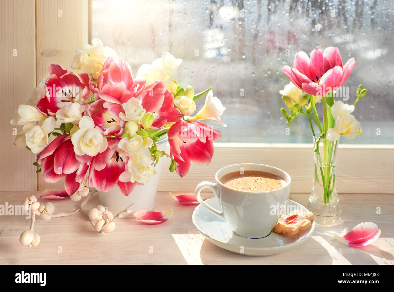 Cup Of Coffee On The Window Board Sunshine After The Rain Spring Flowers Pink Tulips And White Freesia Stock Photo Alamy