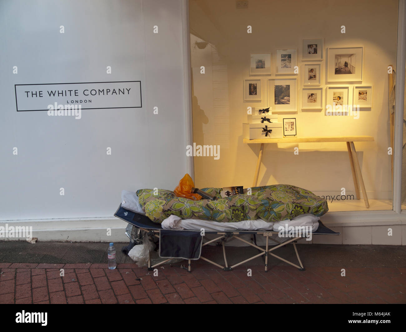 A camping bed set up by a rough sleeper in a Brighton street Stock