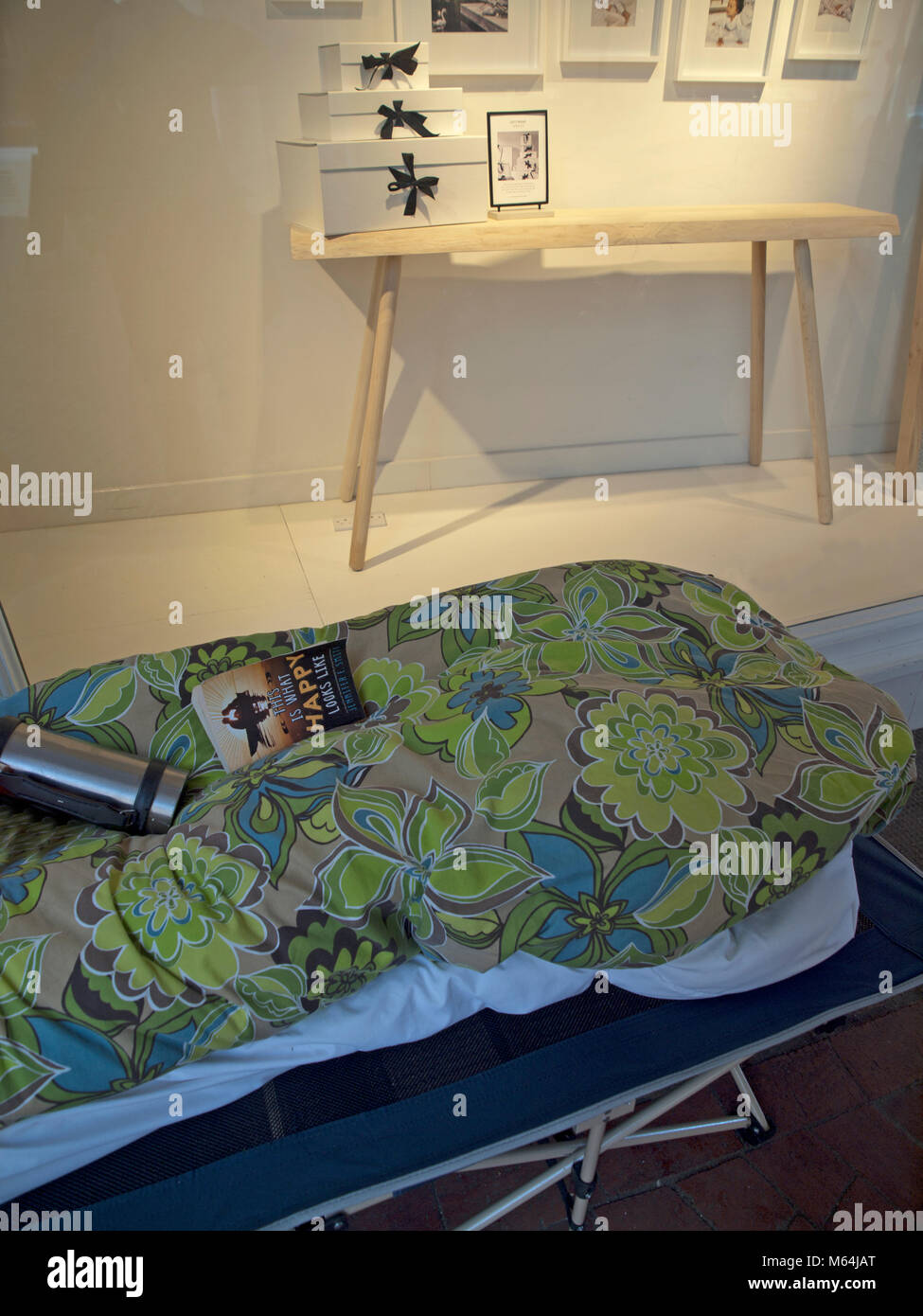 A camping bed set up by a rough sleeper in a Brighton street Stock Photo