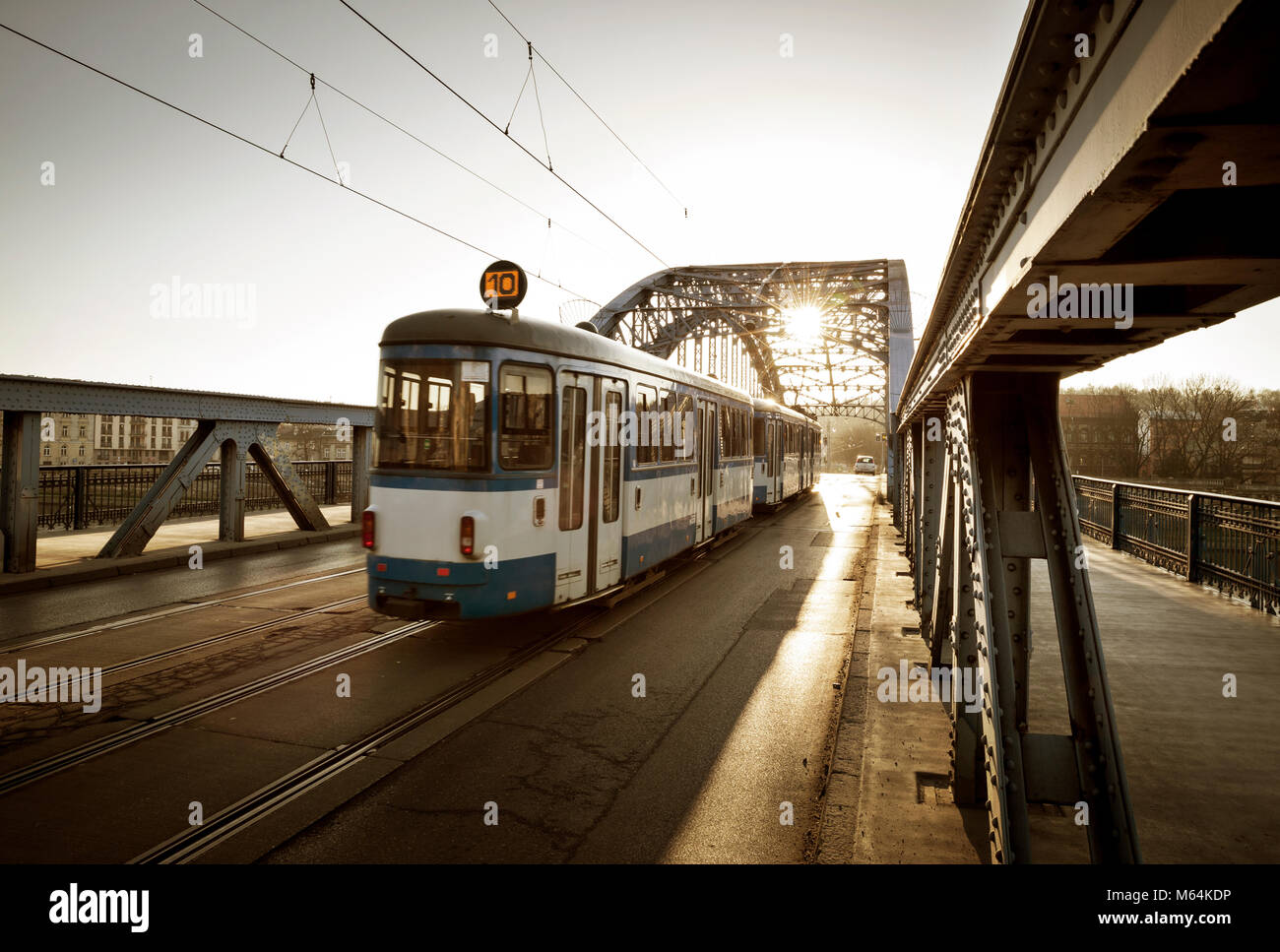Old Tram on the bridge in Krakow city, Poland Stock Photo