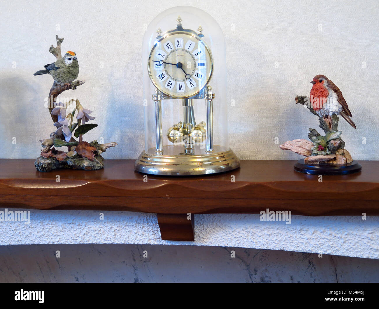 Clock on a mantlepiece Stock Photo Alamy
