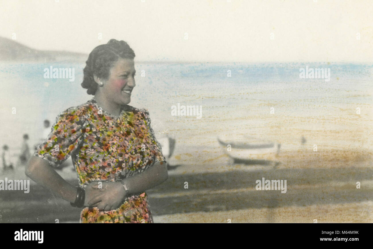 Coloured portrait of a woman on the beach, 1920s Stock Photo