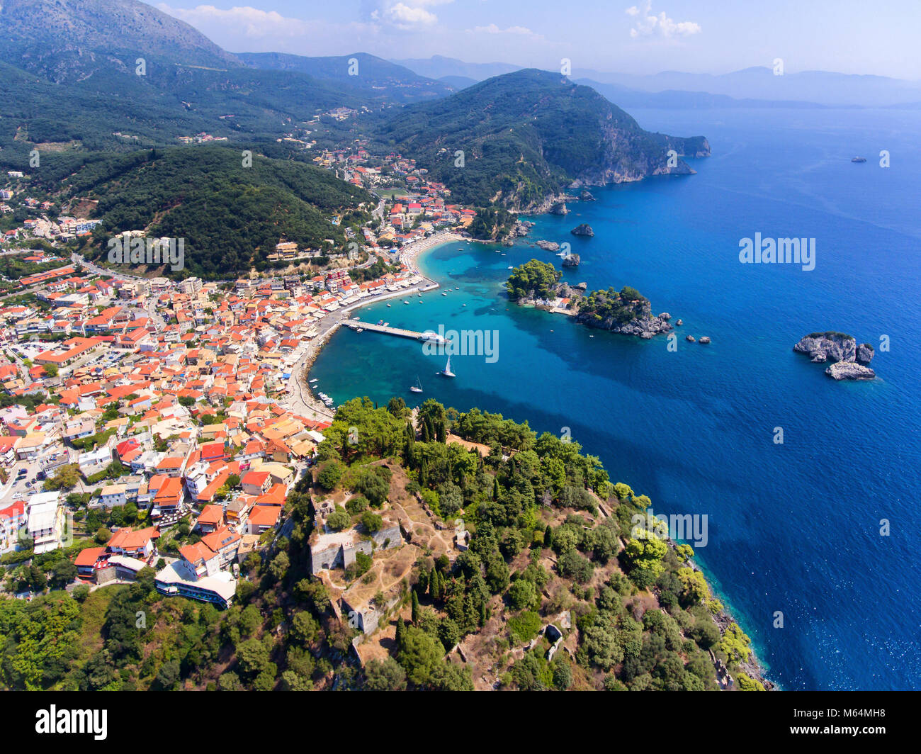 Parga Castle and old village seen from above. Epirus region, Greece. Aerial image. Stock Photo